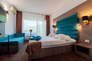 Ένα ή περισσότερα κρεβάτια σε δωμάτιο στο Hotel Orizont