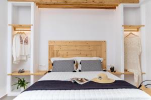 a bedroom with a bed with a hat on it at Alenor City Hotel in Naxos Chora +106 photos