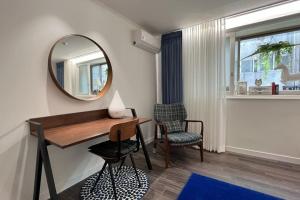 a room with a mirror and a desk and a chair at Hongdae 3bedroom apartment #14 in Seoul