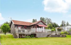 a home with a large yard with a house at Amazing Home In Nssj With House Sea View in Nässjö
