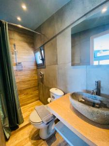 a bathroom with a sink and a toilet at 200Mbps Wifi - Penthouse With Acropolis View in Athens