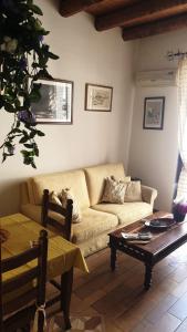 a living room with a couch and a coffee table at Home Casa Professa 2 in Palermo