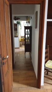 an open door to a hallway with a table at Home Casa Professa 2 in Palermo