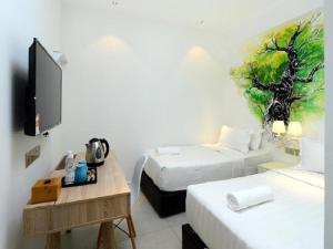 Postel nebo postele na pokoji v ubytování Hotel de Art USJ 21