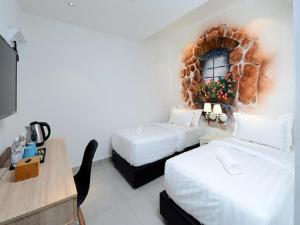 Postel nebo postele na pokoji v ubytování Hotel de Art USJ 21