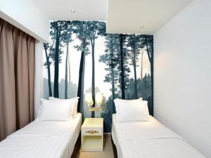 Postel nebo postele na pokoji v ubytování Hotel de Art USJ 21