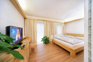 Posteľ alebo postele v izbe v ubytovaní tx HOTEL