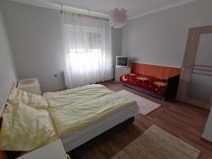 Postel nebo postele na pokoji v ubytování Apátságúti Vendégház