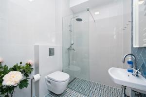 Kúpeľňa v ubytovaní Apartamenty Rakowicka WAWELOFTS