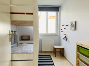 a small bedroom with a bunk bed in it at Wohnung Pauli, FW 2 in Zingst