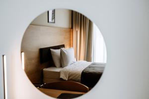 Voodi või voodid majutusasutuse Hotel Septembar toas
