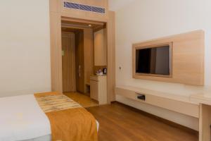 TV a/nebo společenská místnost v ubytování Tivoli Grand Resort