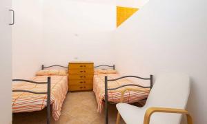Ein Bett oder Betten in einem Zimmer der Unterkunft AmareNumana