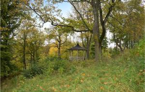 a gazebo in the middle of a field with trees at Nice Apartment In Tranås in Tranås