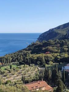 a house on top of a hill next to the ocean at ççç Holiday Properties Le Vele ççç in Montalto di Castro
