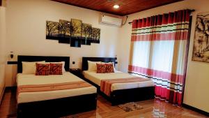 Voodi või voodid majutusasutuse Mihisara Resort toas