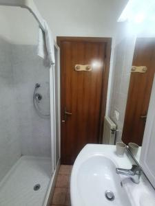 a bathroom with a sink and a shower and a toilet at ççç Holiday Properties Le Vele ççç in Montalto di Castro +68 photos