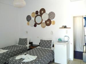 מיטה או מיטות בחדר ב-Nissos Ios
