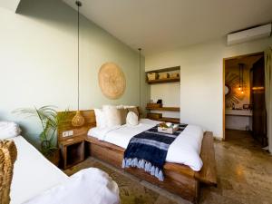 Ένα ή περισσότερα κρεβάτια σε δωμάτιο στο Kai Villas Lombok