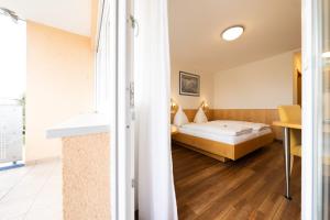 Postel nebo postele na pokoji v ubytování ates Hotel Kehl
