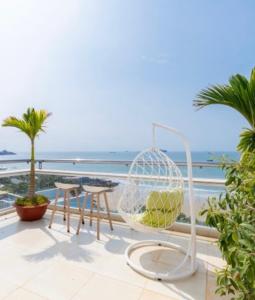 a balcony with a view of the ocean at Homestay coco in Vung Tau