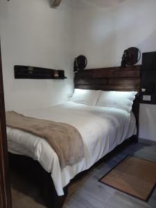 A bed or beds in a room at El Rinconcito