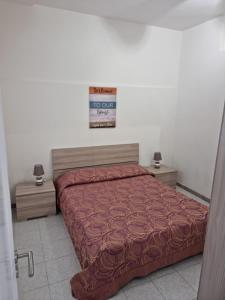 Ліжко або ліжка в номері Casa di nonna Anna