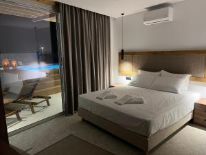 Ένα ή περισσότερα κρεβάτια σε δωμάτιο στο Johannes Boutique Apartments & Suites