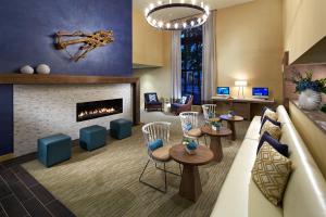 a living room with a couch and a fireplace at The Anza-a Calabasas Hotel in Calabasas