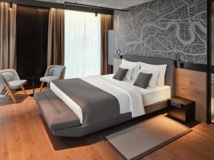 Posteľ alebo postele v izbe v ubytovaní Mövenpick Zagreb
