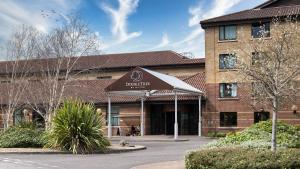a building with a sign in front of it at DoubleTree by Hilton Swindon Hotel in Swindon