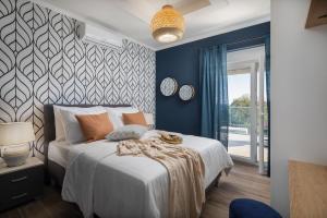a bedroom with a bed with a white bedspread at Villas Pakoštane in Pakoštane +45 photos