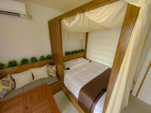 Een bed of bedden in een kamer bij MONKEY'S HOTEL