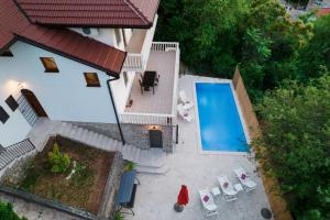 an overhead view of a house with a swimming pool at Villa Old Town Stolac in Stolac
