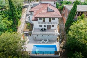 an aerial view of a house with a swimming pool at Villa Old Town Stolac in Stolac