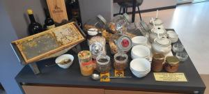 a table with a bunch of dishes and bottles of wine at Boutique hotel Lili in Rovinj