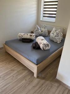 A bed or beds in a room at Apartmánový dom Magda