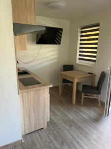 A kitchen or kitchenette at Apartmánový dom Magda