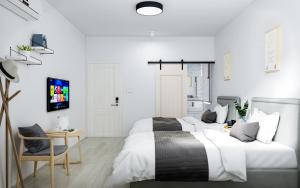 Postel nebo postele na pokoji v ubytování Xiamen 12 Seaside Hotel