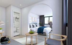 Postel nebo postele na pokoji v ubytování Xiamen 12 Seaside Hotel