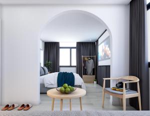 Postel nebo postele na pokoji v ubytování Xiamen 12 Seaside Hotel