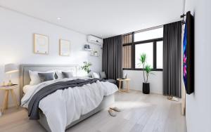 Postel nebo postele na pokoji v ubytování Xiamen 12 Seaside Hotel