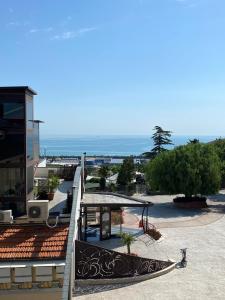 a view of the ocean from a building with a surfboard at VISTAMARE VILLAGE in Silvi Marina