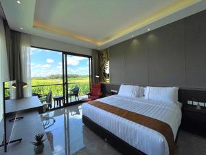 a bedroom with a large bed and a large window at The Valerian Villa Ubud in Ubud +56 photos