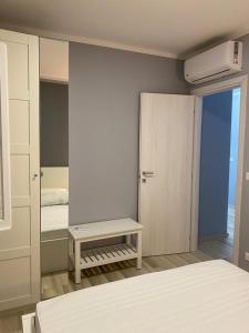 a room with a bedroom with a bed and a table at VISTAMARE VILLAGE in Silvi Marina