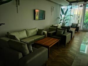 a waiting room with couches and a coffee table at PEARLY HOTEL in Antalya