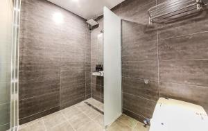 a bathroom with a shower stall and a toilet at Docking Hotel in Gimpo