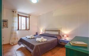 a bedroom with two beds with towels on them at 4 Bedroom Cozy Home In Custonaci in Custonaci