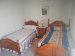 Cama o camas de una habitación en Room in Chalet - Habitacion En Chalet Compartido En Toledo