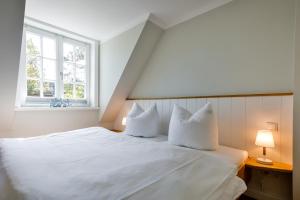 Postel nebo postele na pokoji v ubytování Haus Senwai Hausteil 1